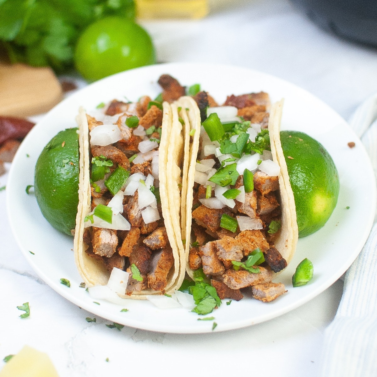https://www.thefoodieaffair.com/wp-content/uploads/2023/02/Spicy-Pork-Tacos-1200.jpg