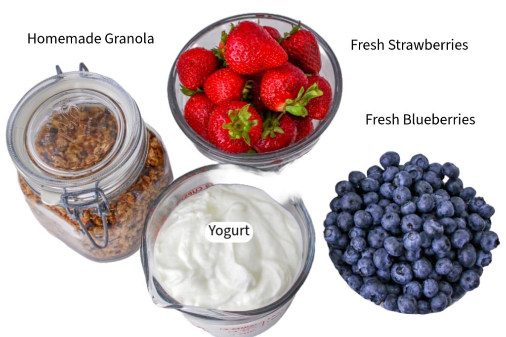 Ingredients to make breakfast parfaits with fresh fruit.