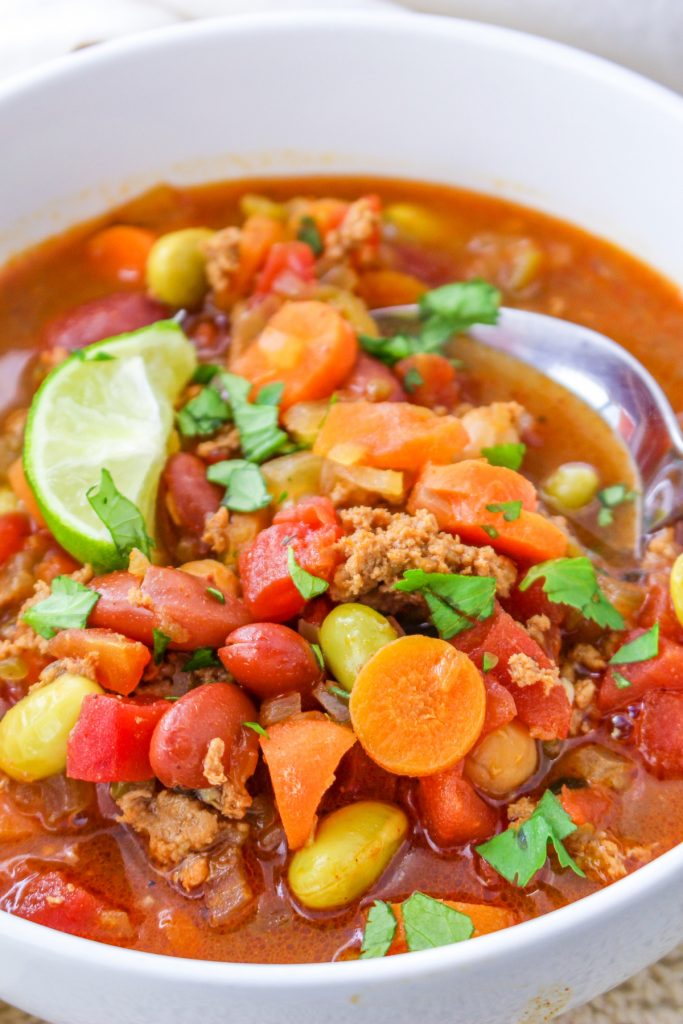 A white soup bowl filled with copycat Panera turkey chili.